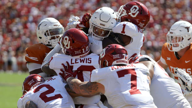 Oklahoma Sooners defensive back Billy Bowman Jr. (2), Oklahoma Sooners linebacker Kip Lewis (10), Oklahoma Sooners linebacker Jaren Kanak (7) and Oklahoma Sooners linebacker Dasan McCullough (1) stop Texas Longhorns running back Jonathon Brooks